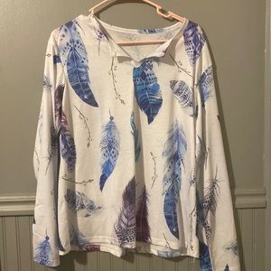 Super cute long sleeve feather shirt. Size M. New!